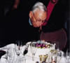 Fred blowing out candles on cake