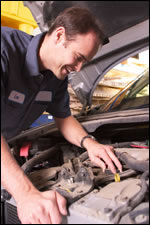 Mechanic looking at engine